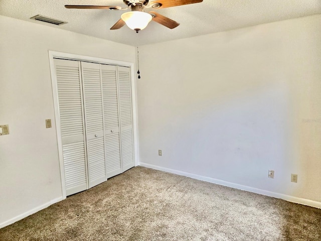 5 Buck Cir # B5, Haines City, FL 33844 - unfurnished bedroom featuring a textured ceiling, carpet floors, a closet, and visible vents