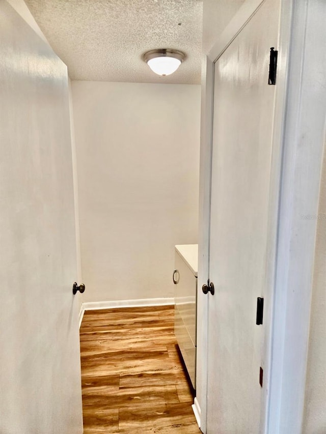 5 Buck Cir # B5, Haines City, FL 33844 - bathroom with baseboards, a textured ceiling, and wood finished floors