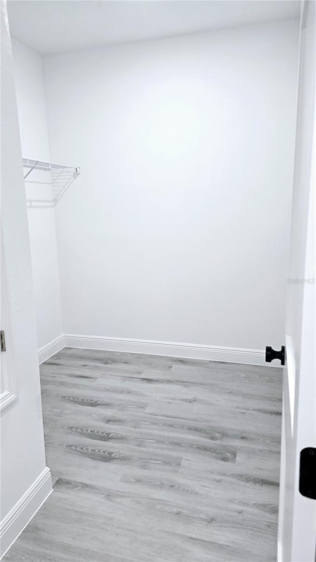 699 Marion Oaks Trl, Ocala, FL 34473 - walk in closet with wood finished floors