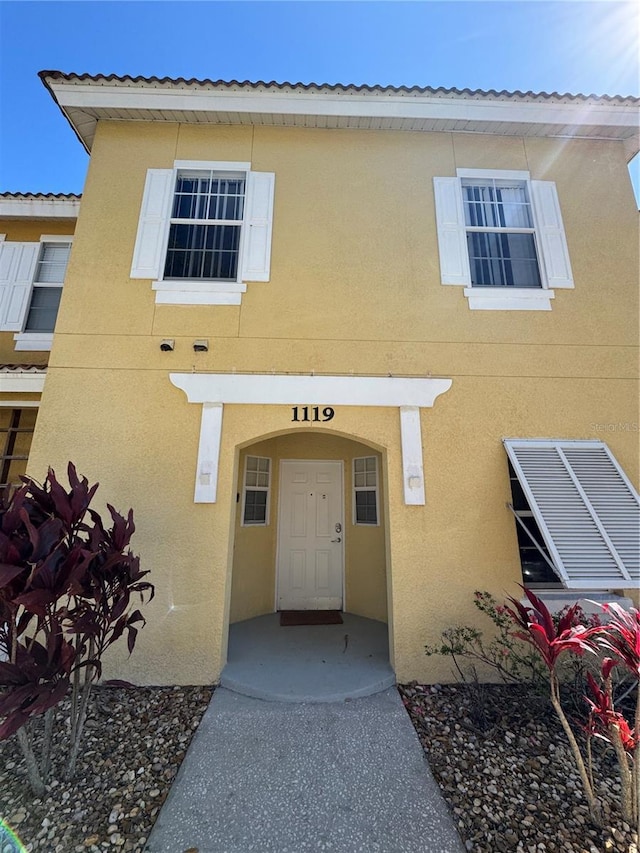 1119 Park Ridge Cir, Kissimmee, FL 34746 - property entrance featuring stucco siding