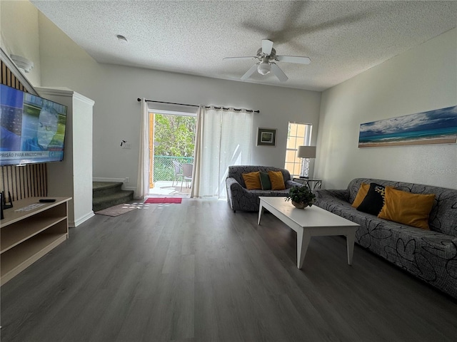 1119 Park Ridge Cir, Kissimmee, FL 34746 - living room with a textured ceiling, stairs, ceiling fan, and wood finished floors