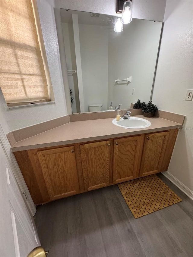 1119 Park Ridge Cir, Kissimmee, FL 34746 - bathroom with toilet, wood finished floors, and vanity