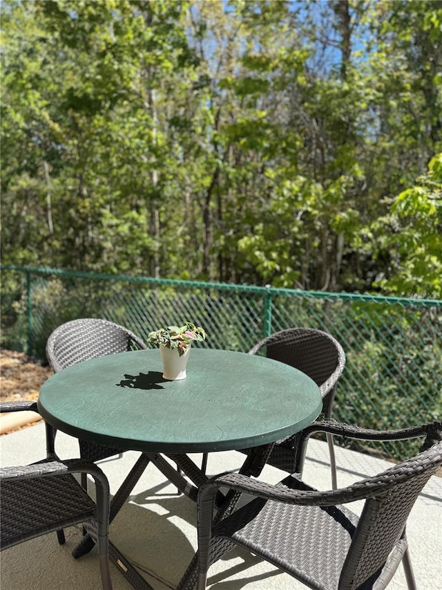 1119 Park Ridge Cir, Kissimmee, FL 34746 - balcony with a patio area and outdoor dining space