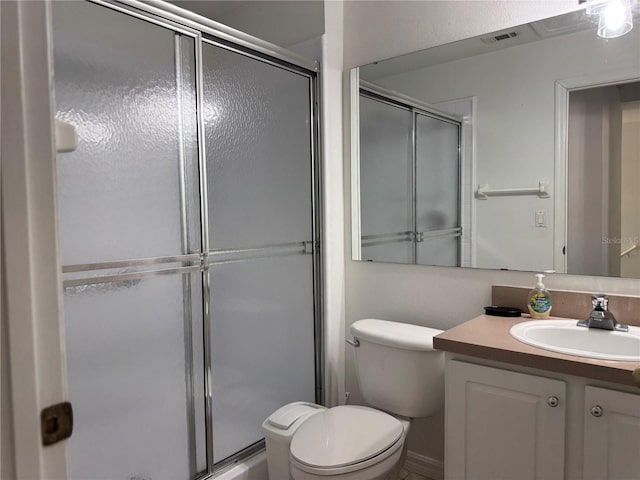 1119 Park Ridge Cir, Kissimmee, FL 34746 - bathroom featuring toilet, visible vents, vanity, and a shower stall