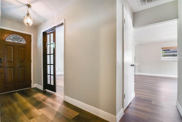 725 Laurel Way, Casselberry, FL 32707 - foyer featuring dark wood-style flooring and baseboards