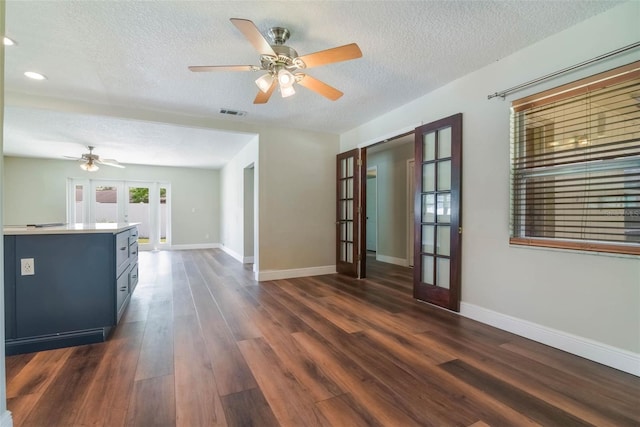 725 Laurel Way, Casselberry, FL 32707 - unfurnished living room featuring french doors, a textured ceiling, ceiling fan, dark wood-style floors, and recessed lighting
