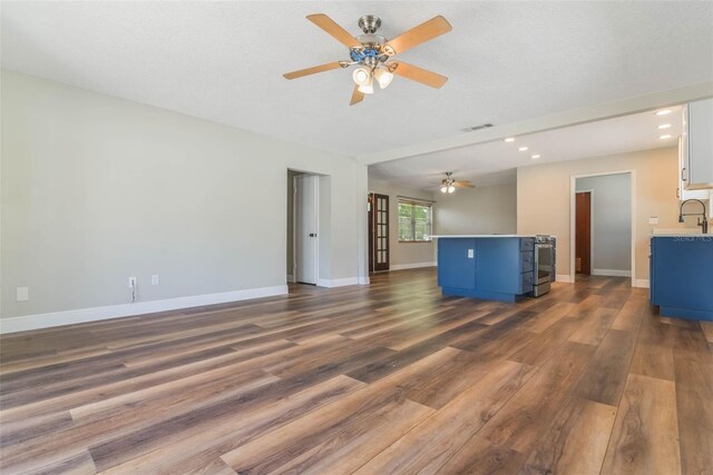 725 Laurel Way, Casselberry, FL 32707 - unfurnished living room featuring recessed lighting, ceiling fan, and dark wood-style flooring