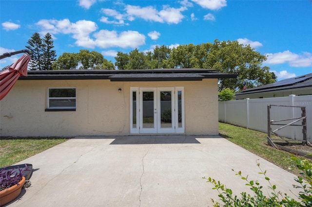 725 Laurel Way, Casselberry, FL 32707 - rear view of property with french doors, stucco siding, and a patio area