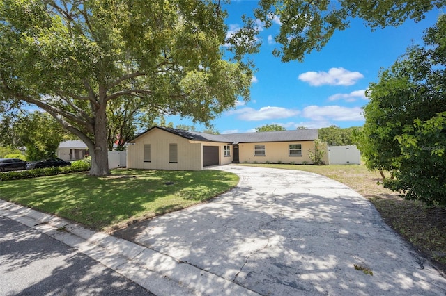 725 Laurel Way, Casselberry, FL 32707 - ranch-style house featuring a garage and driveway