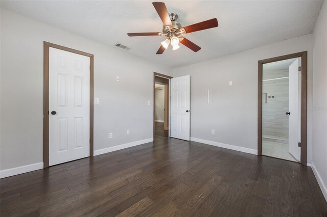 725 Laurel Way, Casselberry, FL 32707 - unfurnished bedroom featuring dark wood-type flooring, ensuite bath, and a ceiling fan