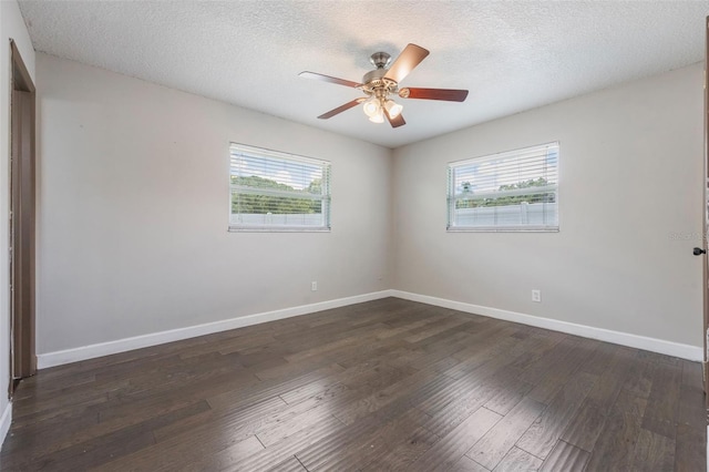 725 Laurel Way, Casselberry, FL 32707 - unfurnished room with healthy amount of natural light, ceiling fan, dark wood finished floors, and a textured ceiling