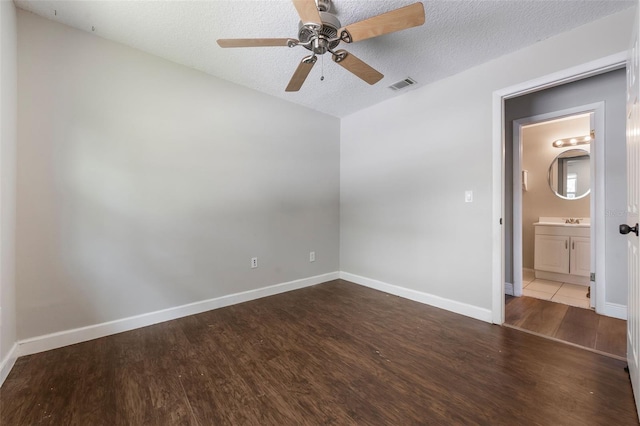725 Laurel Way, Casselberry, FL 32707 - spare room featuring wood finished floors, a ceiling fan, and a textured ceiling