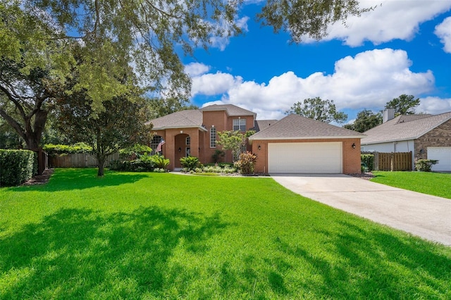 5479 Baytowne Pl, Oviedo, FL 32765 - view of front of home with a front yard, driveway, fence, and an attached garage