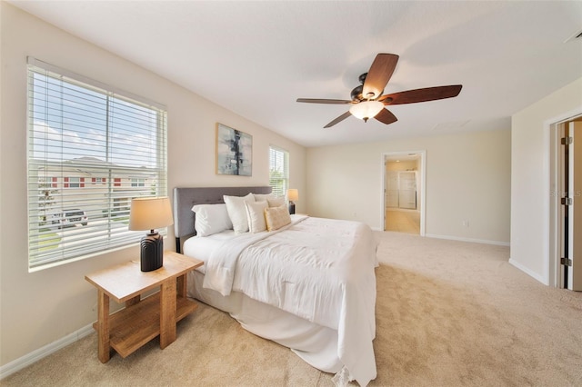 bedroom with ceiling fan, baseboards, and carpet floors
