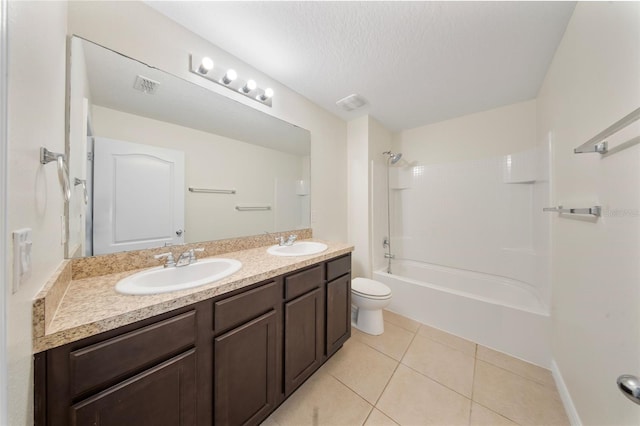 full bath with a sink, toilet, double vanity, and tile patterned flooring
