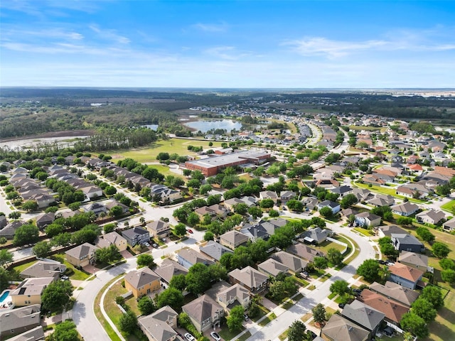 birds eye view of property with a residential view and a water view