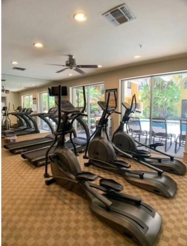 exercise room with ceiling fan, carpet, visible vents, and recessed lighting