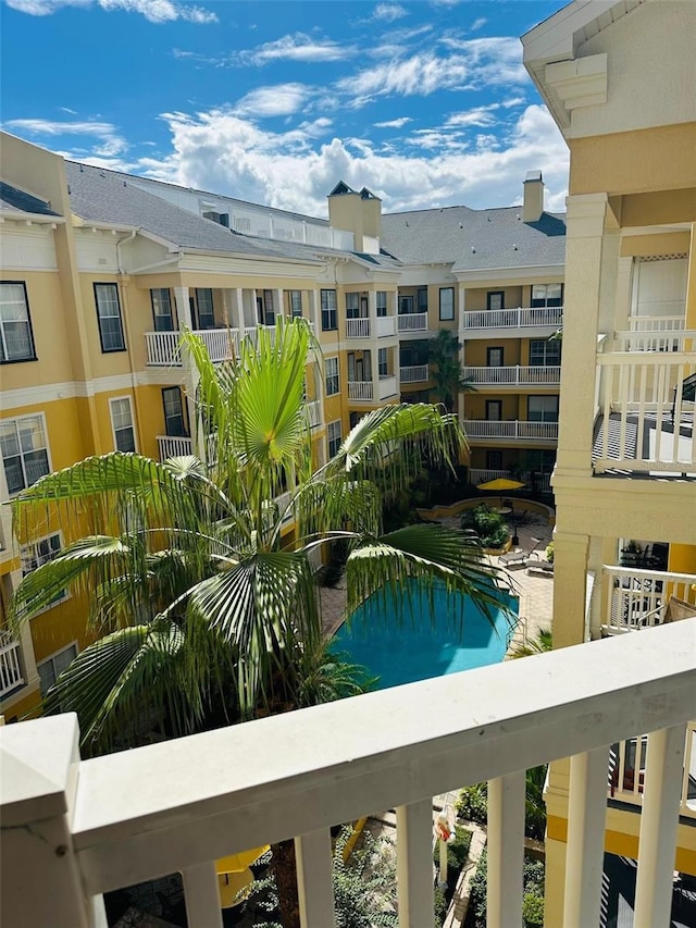 view of pool with a residential view