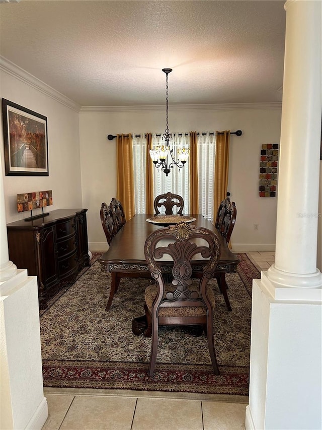 5406 Crepe Myrtle Cir, Kissimmee, FL 34758 - dining room with ornamental molding, ornate columns, a textured ceiling, and a chandelier