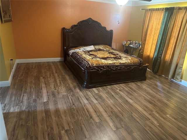 5406 Crepe Myrtle Cir, Kissimmee, FL 34758 - bedroom featuring baseboards and dark wood-style floors