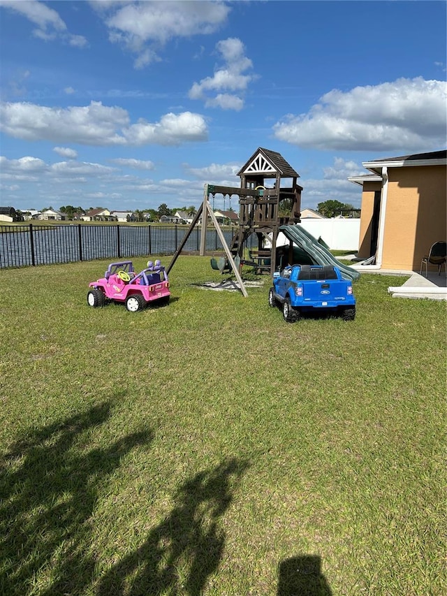 5406 Crepe Myrtle Cir, Kissimmee, FL 34758 - view of yard featuring a playground and fence