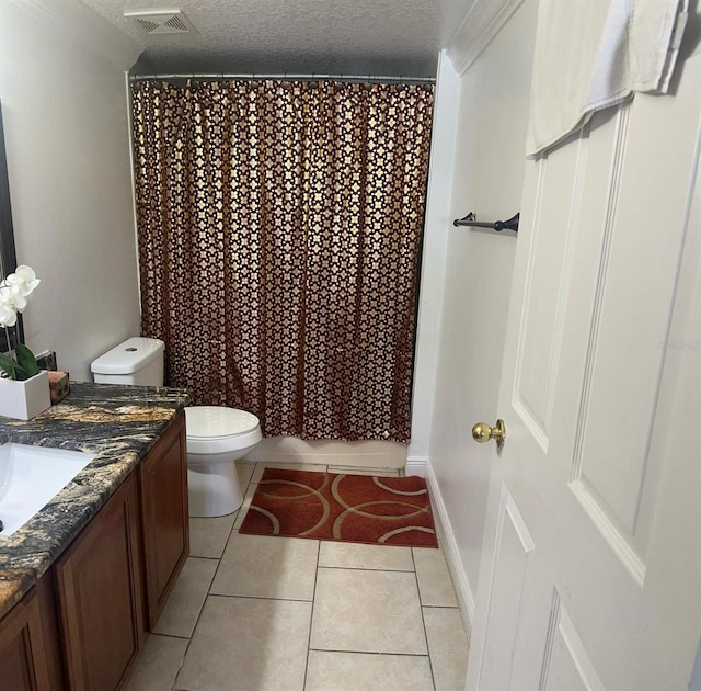 5406 Crepe Myrtle Cir, Kissimmee, FL 34758 - full bathroom featuring visible vents, tile patterned flooring, vanity, toilet, and a textured ceiling