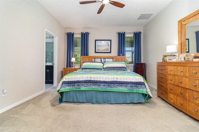 bedroom featuring carpet floors, visible vents, and multiple windows