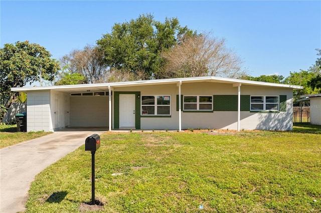 101 W Wallace St, Orlando, FL 32809 - mid-century inspired home with driveway, a carport, and a front lawn