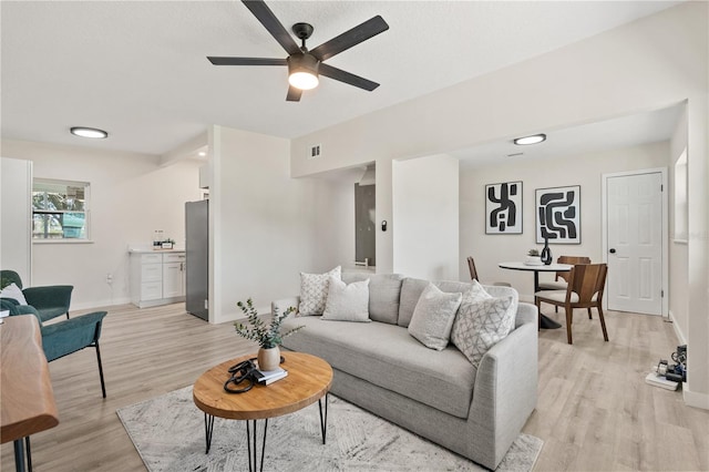 101 W Wallace St, Orlando, FL 32809 - living area with baseboards, visible vents, light wood-style flooring, and ceiling fan