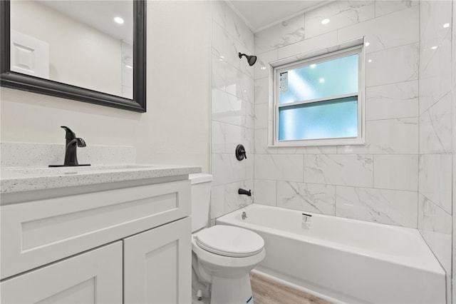 101 W Wallace St, Orlando, FL 32809 - full bathroom with toilet, vanity, tub / shower combination, and wood finished floors