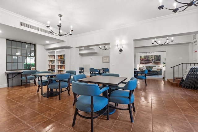 dining space featuring crown molding, tile patterned flooring, visible vents, and a chandelier