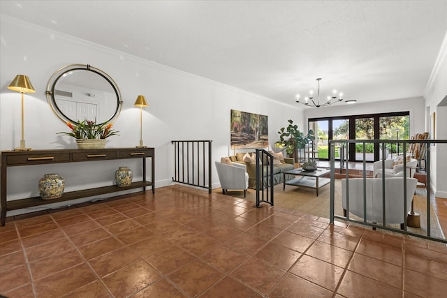 living area featuring crown molding, a notable chandelier, and baseboards