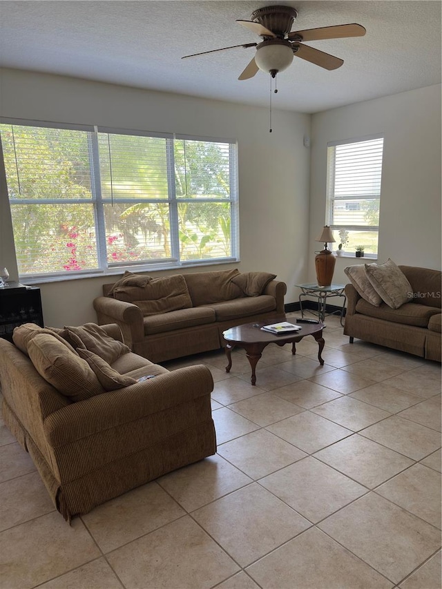 422 Janice Kay Pl, Kissimmee, FL 34744 - living area featuring light tile patterned flooring, a textured ceiling, and a ceiling fan