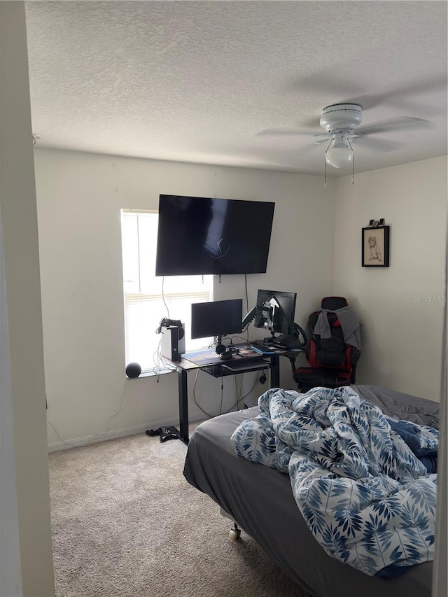 422 Janice Kay Pl, Kissimmee, FL 34744 - bedroom featuring carpet floors, a textured ceiling, and ceiling fan