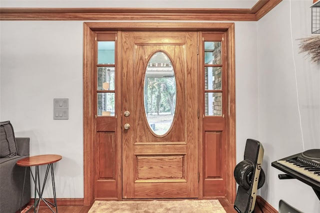 2475 Cox Rd, Cocoa, FL 32926 - entryway with baseboards and ornamental molding