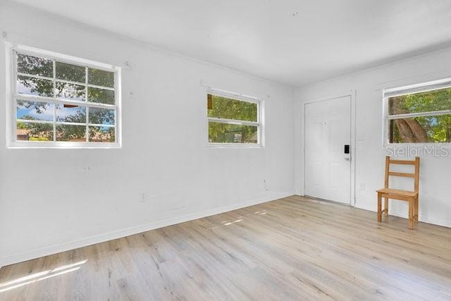 empty room with wood finished floors and baseboards