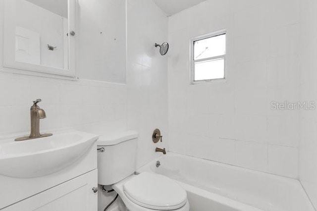 full bathroom with toilet, shower / bathtub combination, vanity, and tile walls
