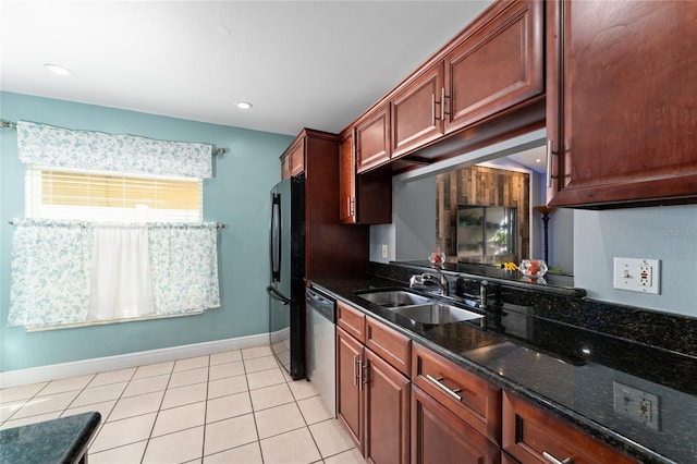 221 Indian Point Cir, Kissimmee, FL 34746 - kitchen featuring baseboards, light tile patterned floors, freestanding refrigerator, dishwasher, and a sink
