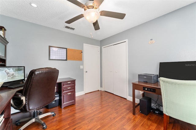 221 Indian Point Cir, Kissimmee, FL 34746 - office featuring visible vents, baseboards, a ceiling fan, and wood finished floors