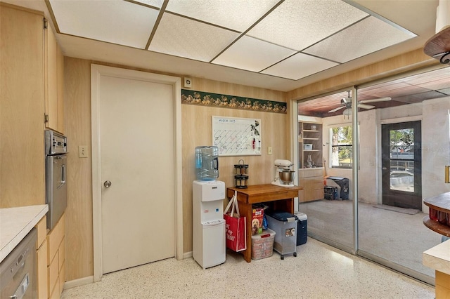 office space featuring a ceiling fan and light speckled floor