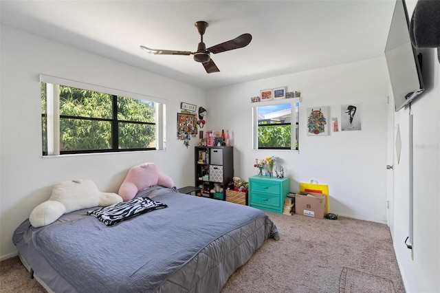 bedroom with baseboards, ceiling fan, and carpet flooring