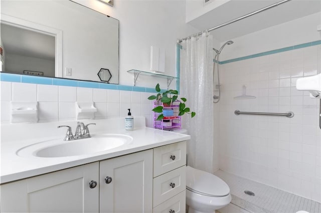 full bath featuring toilet, a shower stall, and vanity