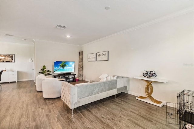 11150 Whistling Pine Way, Orlando, FL 32832 - living area featuring baseboards, visible vents, crown molding, and wood finished floors