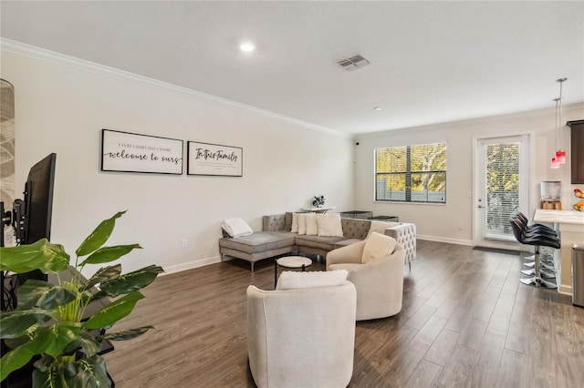 11150 Whistling Pine Way, Orlando, FL 32832 - living area featuring dark wood-style floors, crown molding, and baseboards