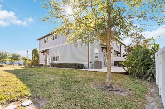 11150 Whistling Pine Way, Orlando, FL 32832 - exterior space with cooling unit, a yard, and a patio
