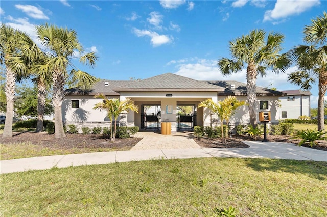 11150 Whistling Pine Way, Orlando, FL 32832 - view of front of property featuring stucco siding, a gate, fence, and a front yard