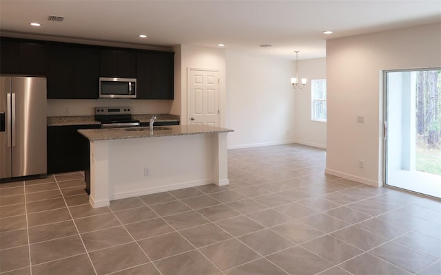 kitchen with recessed lighting, a sink, visible vents, appliances with stainless steel finishes, and dark cabinets