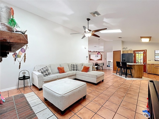 1007 Gammage Pt, Oviedo, FL 32765 - living room featuring lofted ceiling, light tile patterned flooring, and ceiling fan