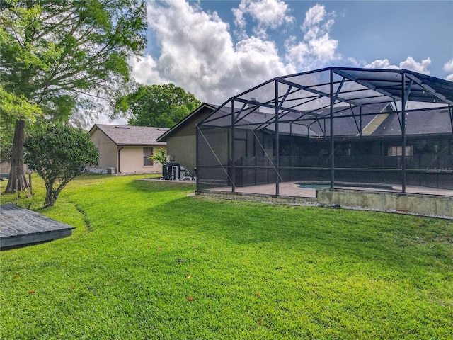 1007 Gammage Pt, Oviedo, FL 32765 - view of green lawn with an outdoor pool, a patio area, and glass enclosure