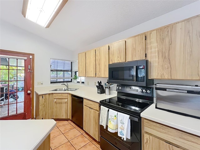 1007 Gammage Pt, Oviedo, FL 32765 - kitchen featuring black appliances, light brown cabinetry, lofted ceiling, a sink, and light tile patterned flooring